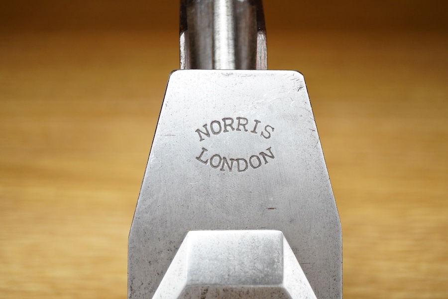 A Norris 50G adjustable gunmetal, steel soled smoothing plane, stamped with Norris, London to both the brass lever cap and the iron, with owner’s name stamped to the handle